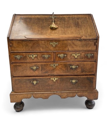 Lot 1107 - A George I walnut bureau