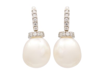 Lot 129 - A good pair of modern 18ct white gold, white cultured pearl and diamond set, pendant earrings.