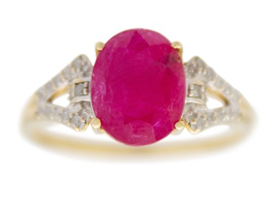 Lot 133 - A 9ct ruby and diamond set dress ring.