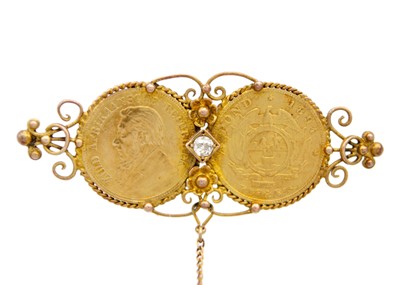 Lot 140 - A brooch formed by two 1/2 Pond gold coins and set with a diamond.