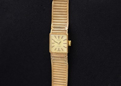 Lot 130 - TISSOT - A Stylist 9ct lady's manual wind bracelet wristwatch.