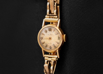 Lot 164 - A MuDu 18ct cased lady's manual wind watch with 9ct expanding bracelet.