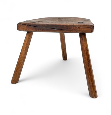 Lot 1023 - A country milking stool