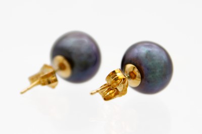 Lot 155 - A pair of 9ct oblate spheroid cultured black pearl stud earrings.