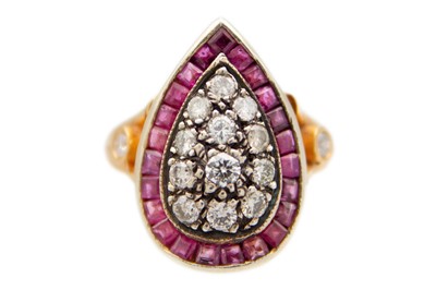 Lot 159 - A rose gold diamond and ruby set dress ring.