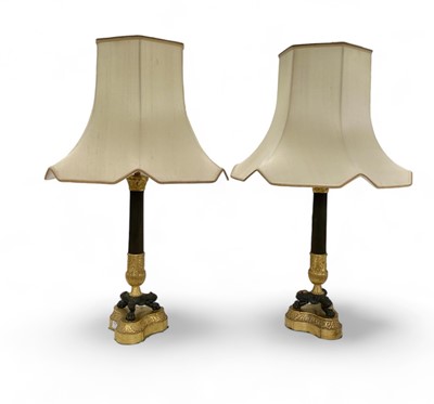 Lot 1600 - A pair of Empire style ormolu and bronze table lamps