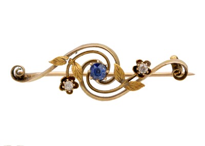 Lot 116 - An Edwardian 15ct diamond and blue sapphire set brooch.