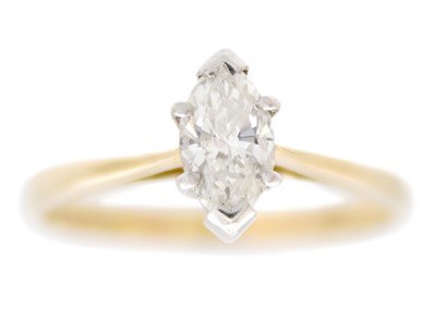 Lot 192 - A 14ct yellow and white gold solitaire ring set with a 0.60ct marquise cut diamond.