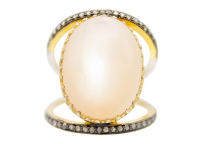 Lot 205 - A large silver gilt oval cabochon moonstone and diamond dress ring.