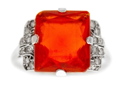 Lot 245 - An Art Deco white metal fire opal and white sapphire set dress ring.