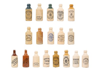 Lot 1359 - A collection of eighteen various stoneware gingerbeer bottles.