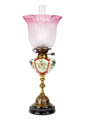 Lot 325 - A late Victorian oil lamp with large cranberry etched shade.