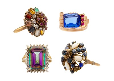 Lot 255 - Four gold gem set rings.