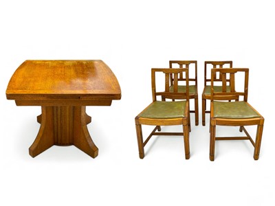 Lot 1700 - An Art Deco oak draw-leaf dining table and four chairs.