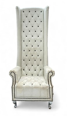 Lot 1549 - A white leather Porter's chair