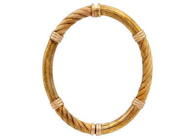 Lot 6 - An Italian 9ct hollow gold, rope design, hinged bangle.