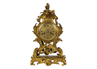 Lot 535 - A French ormolu rococo revival mantel clock, 19th century.