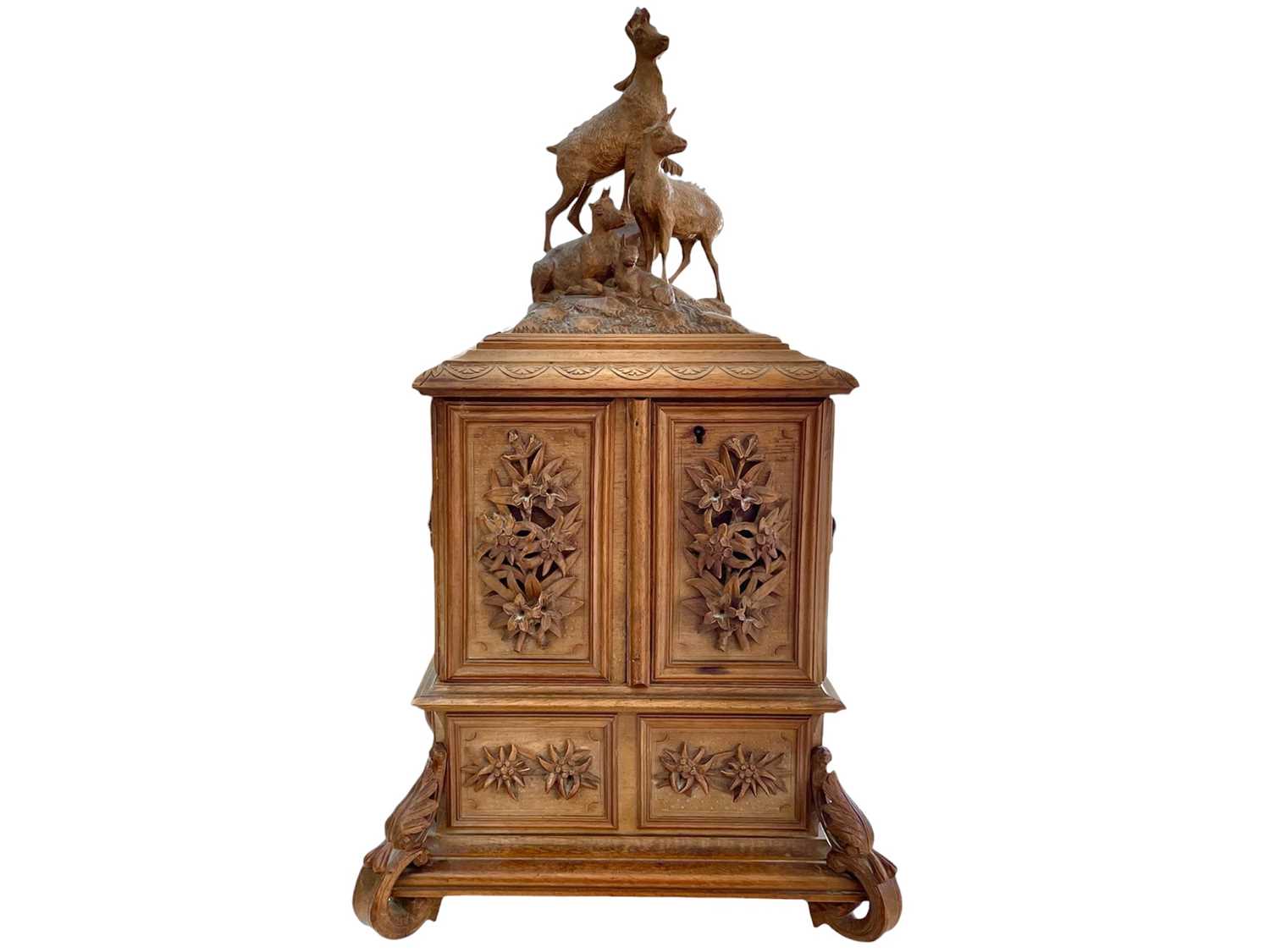 Lot 108 - A Black Forest carved linden wood jewellery casket.