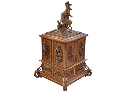 Lot 108 - A Black Forest carved linden wood jewellery casket.