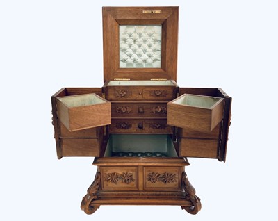 Lot 108 - A Black Forest carved linden wood jewellery casket.