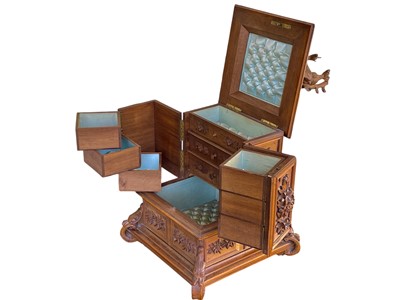 Lot 108 - A Black Forest carved linden wood jewellery casket.