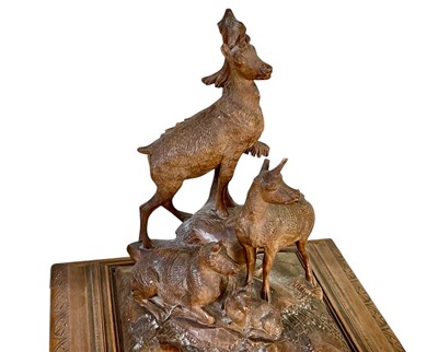 Lot 108 - A Black Forest carved linden wood jewellery casket.
