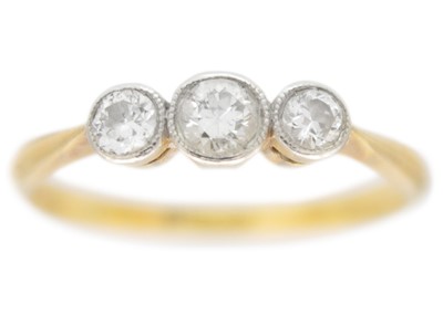 Lot 158 - An 18ct and platinum diamond set three-stone ring.