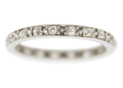 Lot 218 - An early 20th-century platinum diamond set full eternity ring.