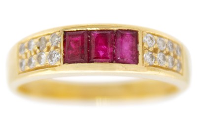 Lot 235 - An 18ct hallmarked gold ruby and diamond set half hoop ring.