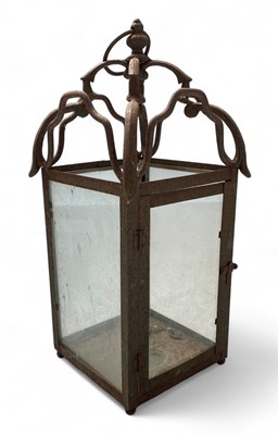 Lot 312 - An iron framed outdoor hanging lantern