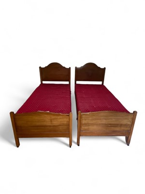 Lot 910 - A pair of Heals single beds and mattresses.