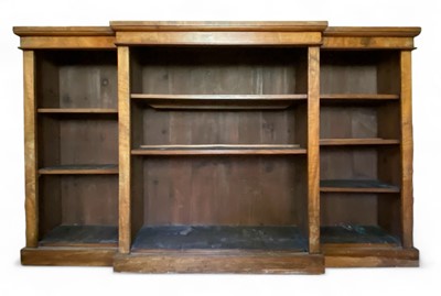 Lot 889 - A late Victorian walnut breakfront open bookcase.