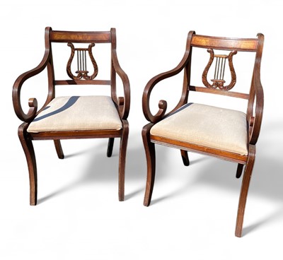 Lot 877 - A set of eight lyre back chairs.