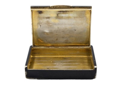 Lot 327 - CARTIER - A silver and black enamel tobacco box.