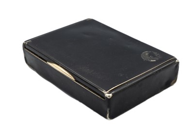 Lot 327 - CARTIER - A silver and black enamel tobacco box.