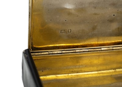 Lot 327 - CARTIER - A silver and black enamel tobacco box.