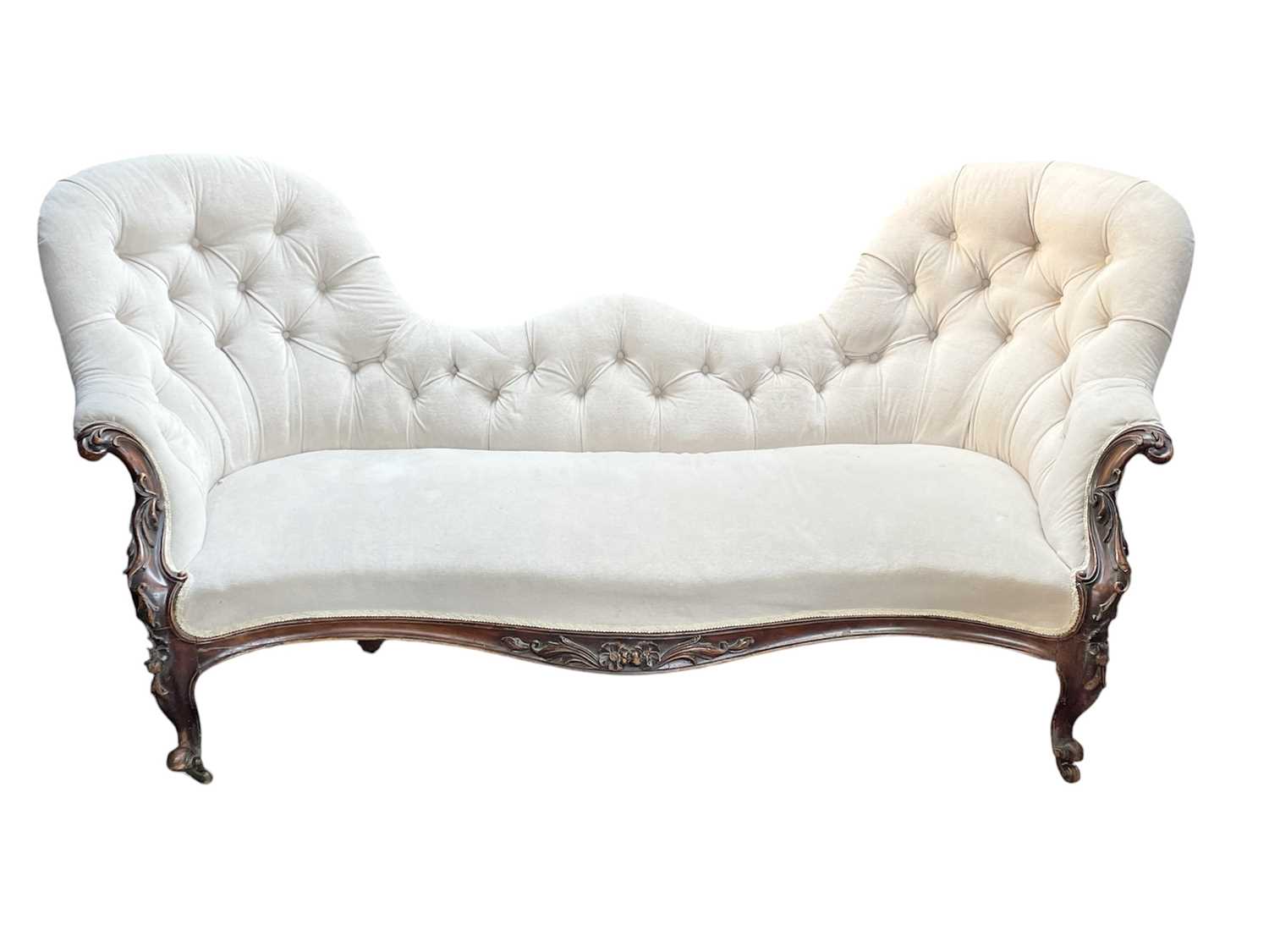 Lot 962 - A Victorian mahogany double spoon back settee.