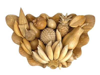 Lot 174 - A treen carved shell shaped fruit bowl and various fruits.