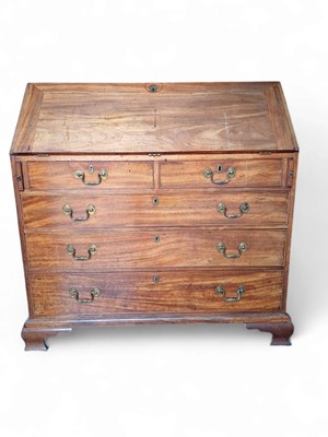 Lot 933 - A George III mahogany bureau.