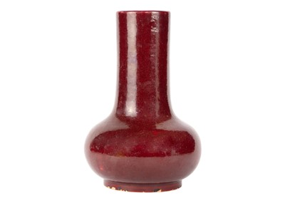 Lot 10 - A Chinese style sang-de-boeuf glazed porcelain bottle vase, circa 1900.