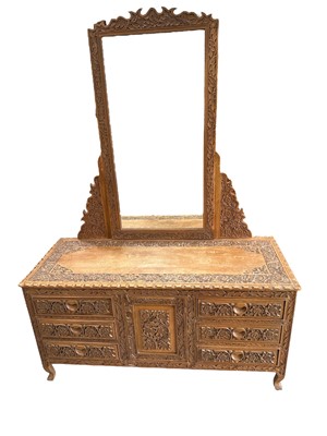 Lot 36 - A Kashmir carved walnut dressing table  The...