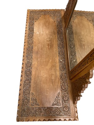 Lot 36 - A Kashmir carved walnut dressing table The...