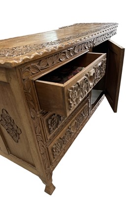 Lot 36 - A Kashmir carved walnut dressing table The...