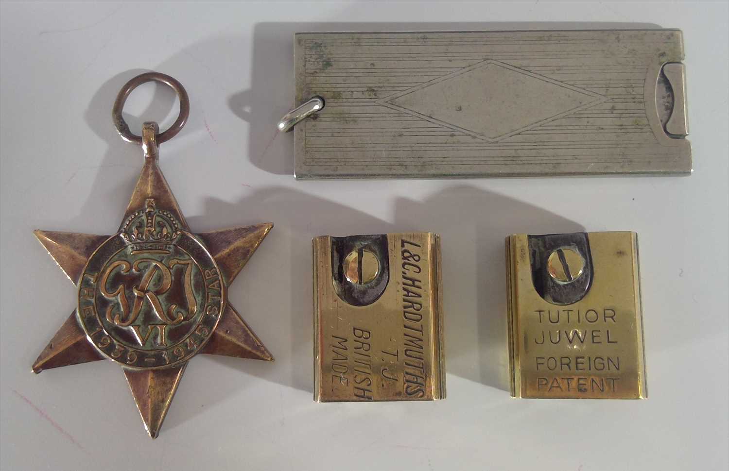 Lot 67 - Two brass pencil sharpeners, one inscribed...
