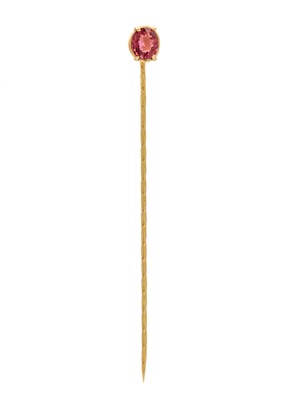 Lot 216 - An 18ct gold 1.5ct pink tourmaline set stick pin by James Suddaby.