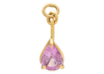 Lot 170 - An 18ct gold 0.95ct pink sapphire set pendant by James Suddaby.