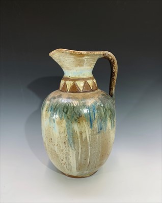 Lot 911 - A large studio pottery stoneware ewer, with...