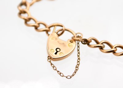 Lot 1 - A 9ct curb link bracelet with padlock clasp.