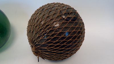Lot 298 - Three vintage glass fishing floats, each 13cm...