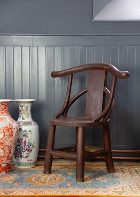 Lot 20 - A Chinese style rustic wood armchair.